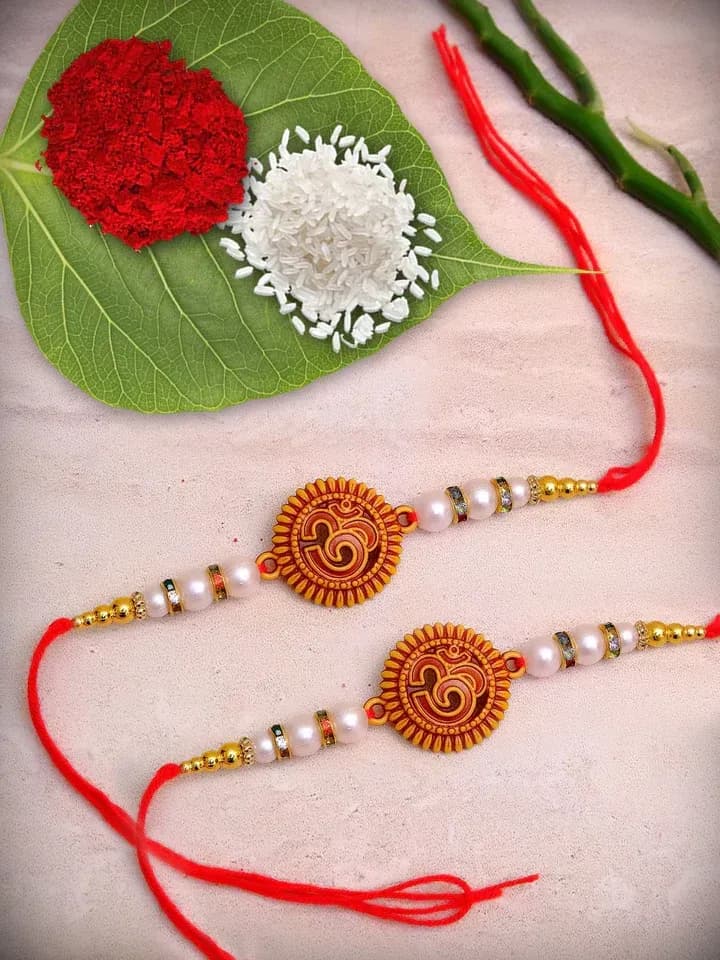 Om Pearl Rakhi Combo Set with Traditional Bead Design