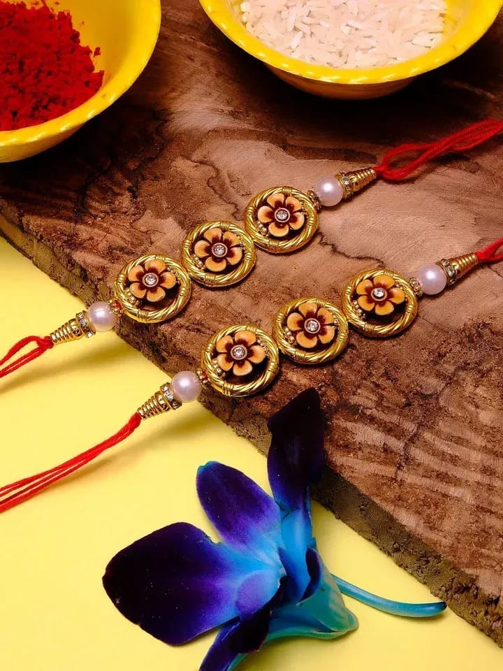 Golden Floral Pearl Rakhi Set with Traditional Design