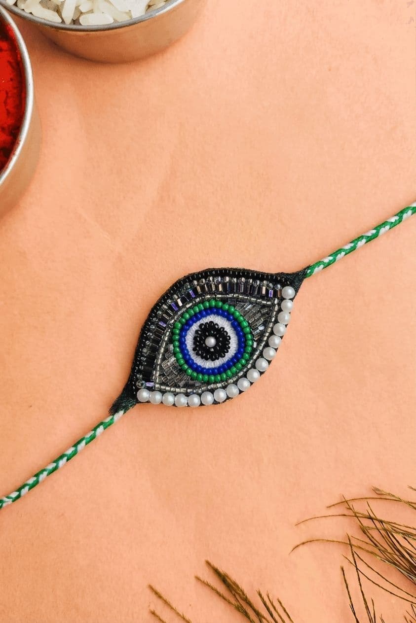 Handmade Evil Eye Rakhi for Brother with Green Bead Work
