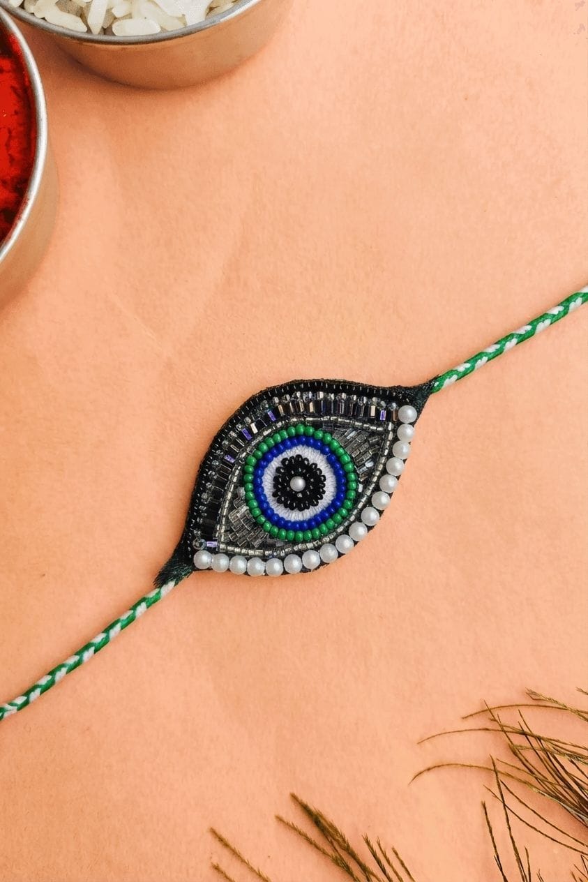 Handmade Evil Eye Rakhi for Brother with Green Bead Work