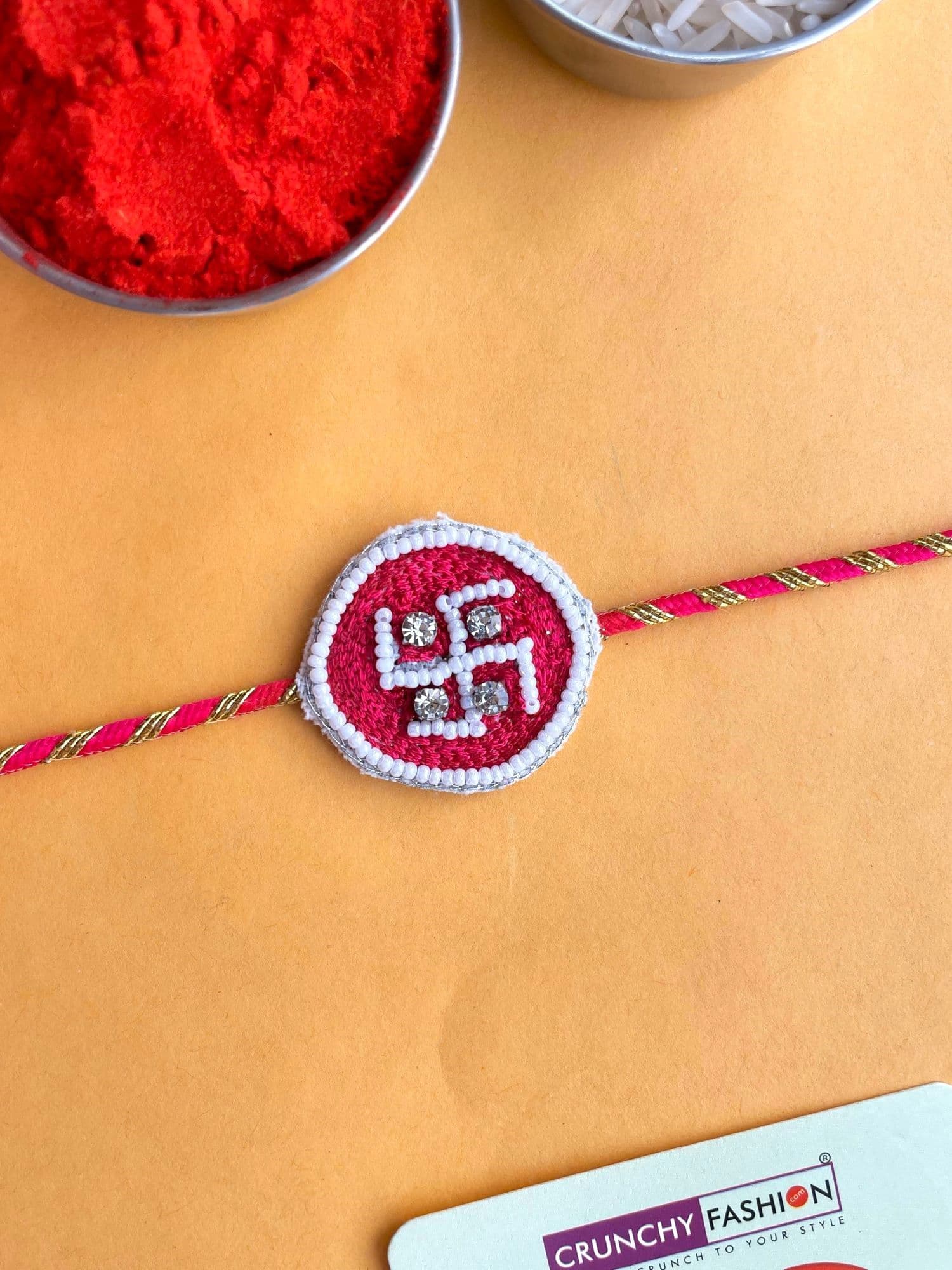 Swastik Rakhi with Pink Handmade Beaded Embroidery