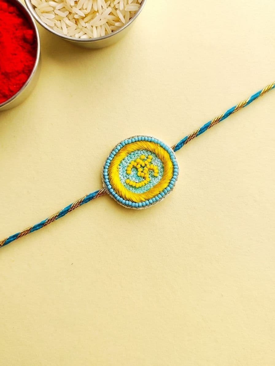 Yellow Om Rakhi with Handmade Beaded Embroidery
